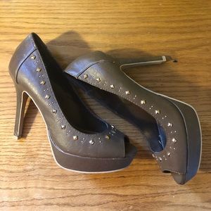 Brown heels with diamond studs.